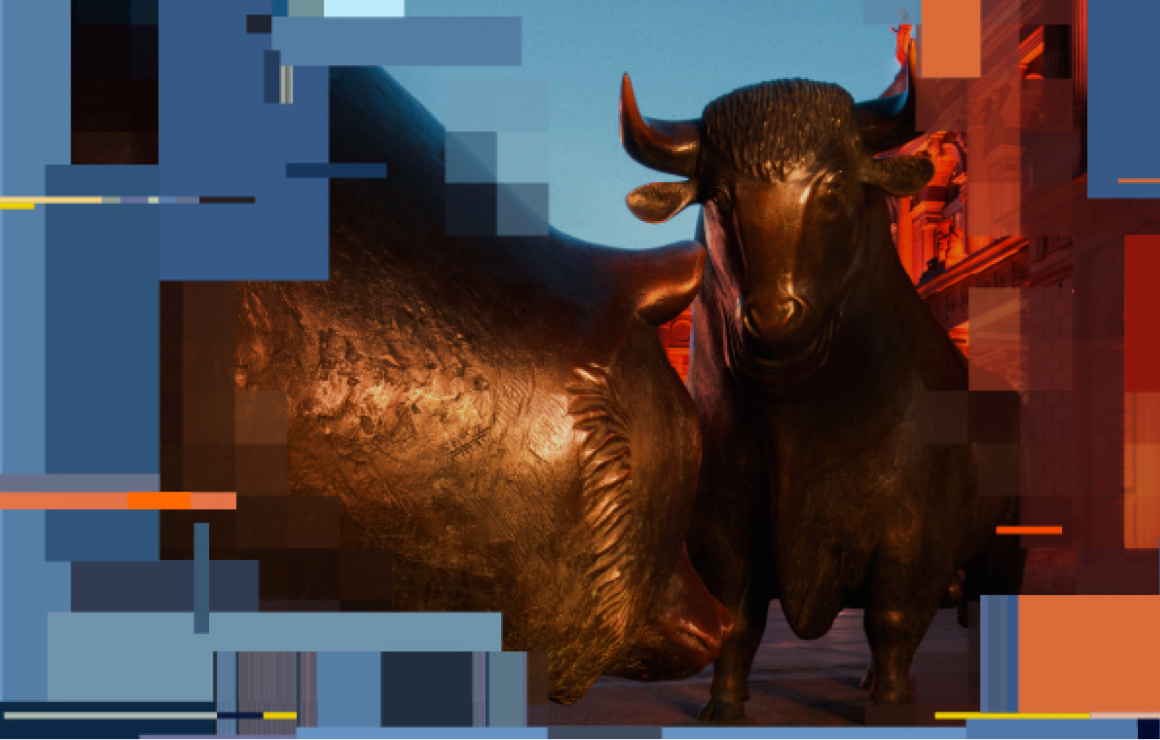 Two bronze bull statues positioned closely together, with a warm light casting shadows on their textured surfaces.