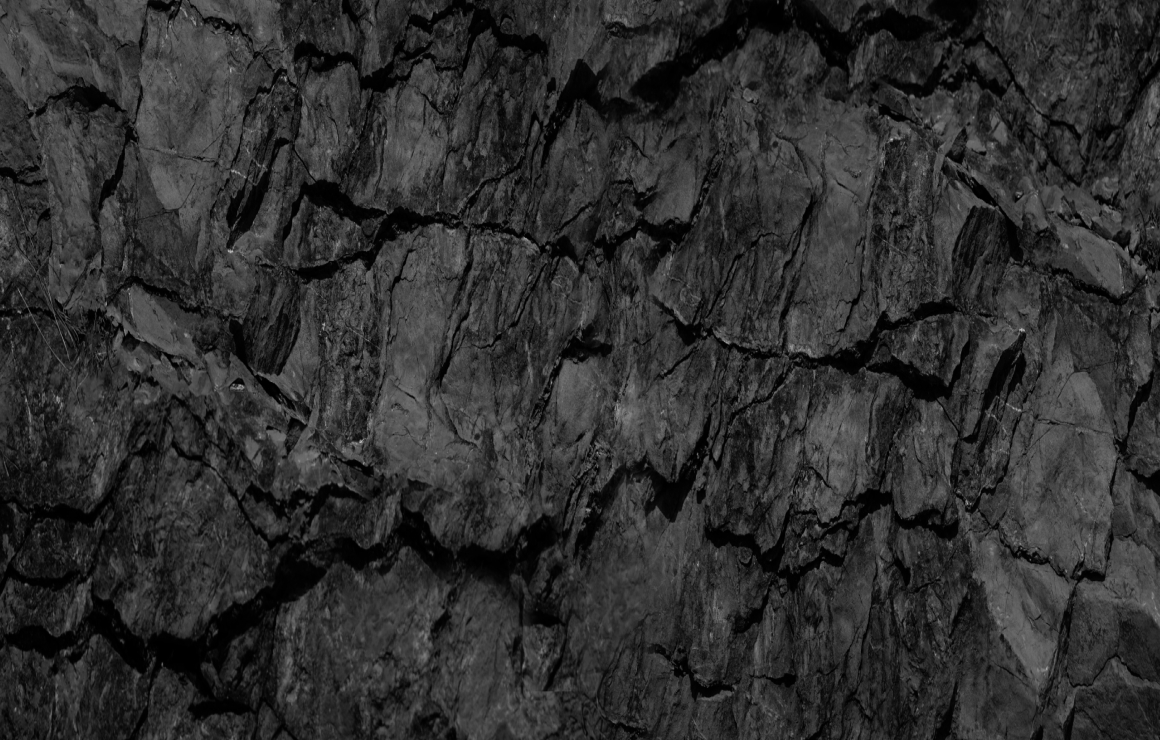 Close up of a laptop with blurry night lights background.