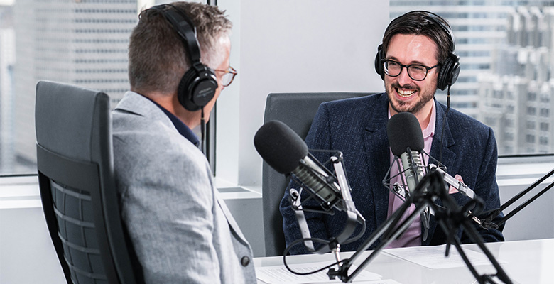 Close up of Paul Close up of Ricard and Sean Ringstead recording the podcast.