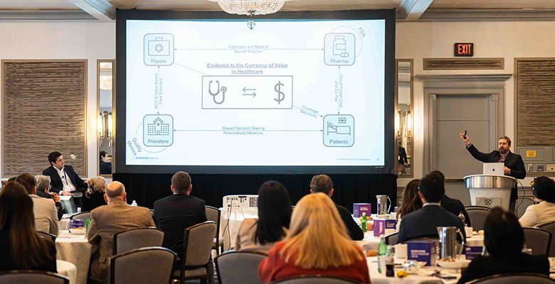 Photography of a healthcare presentation in a large room.