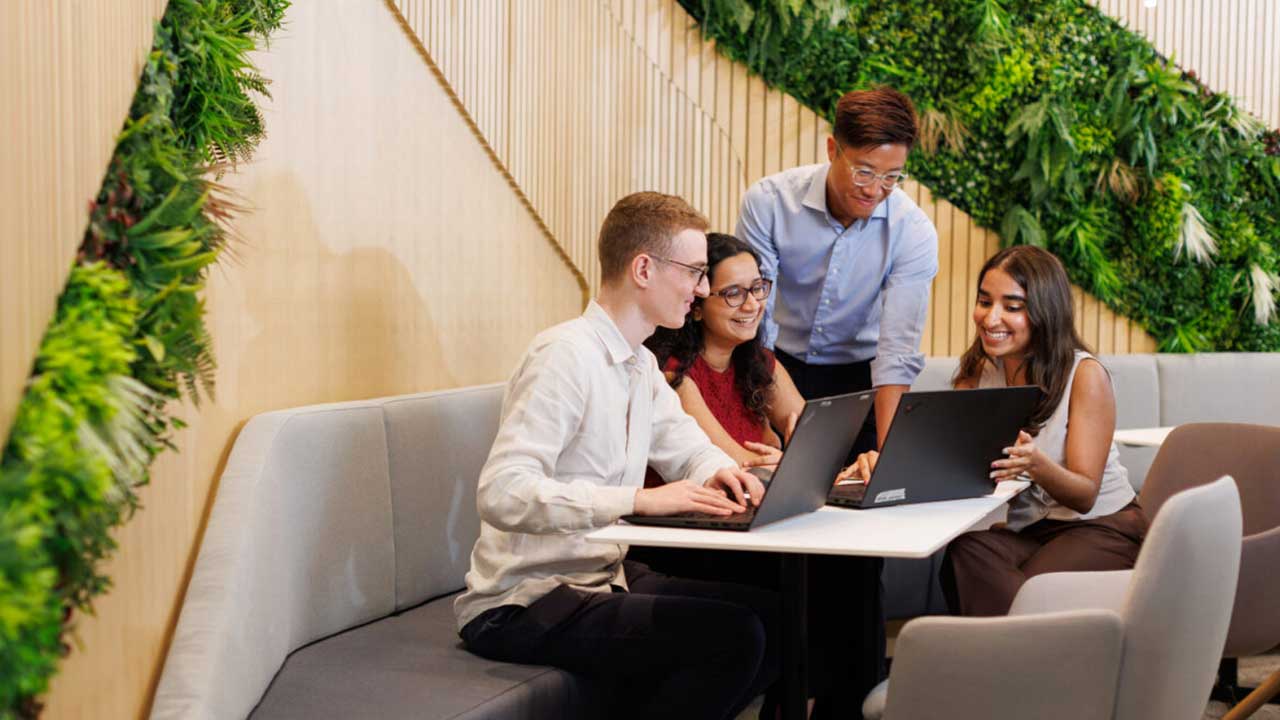 Video thumbnail of professionals in an office. Video highlights the benefits of joining the Oliver Wyman APR team.