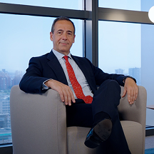 Image of partner sitting in a conference room