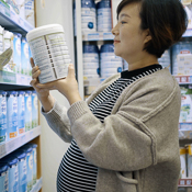 Pregnant woman choosing baby formula