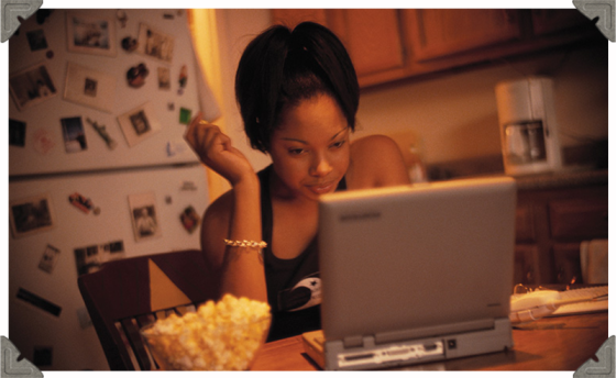 a picture of a woman with her laptop thinking