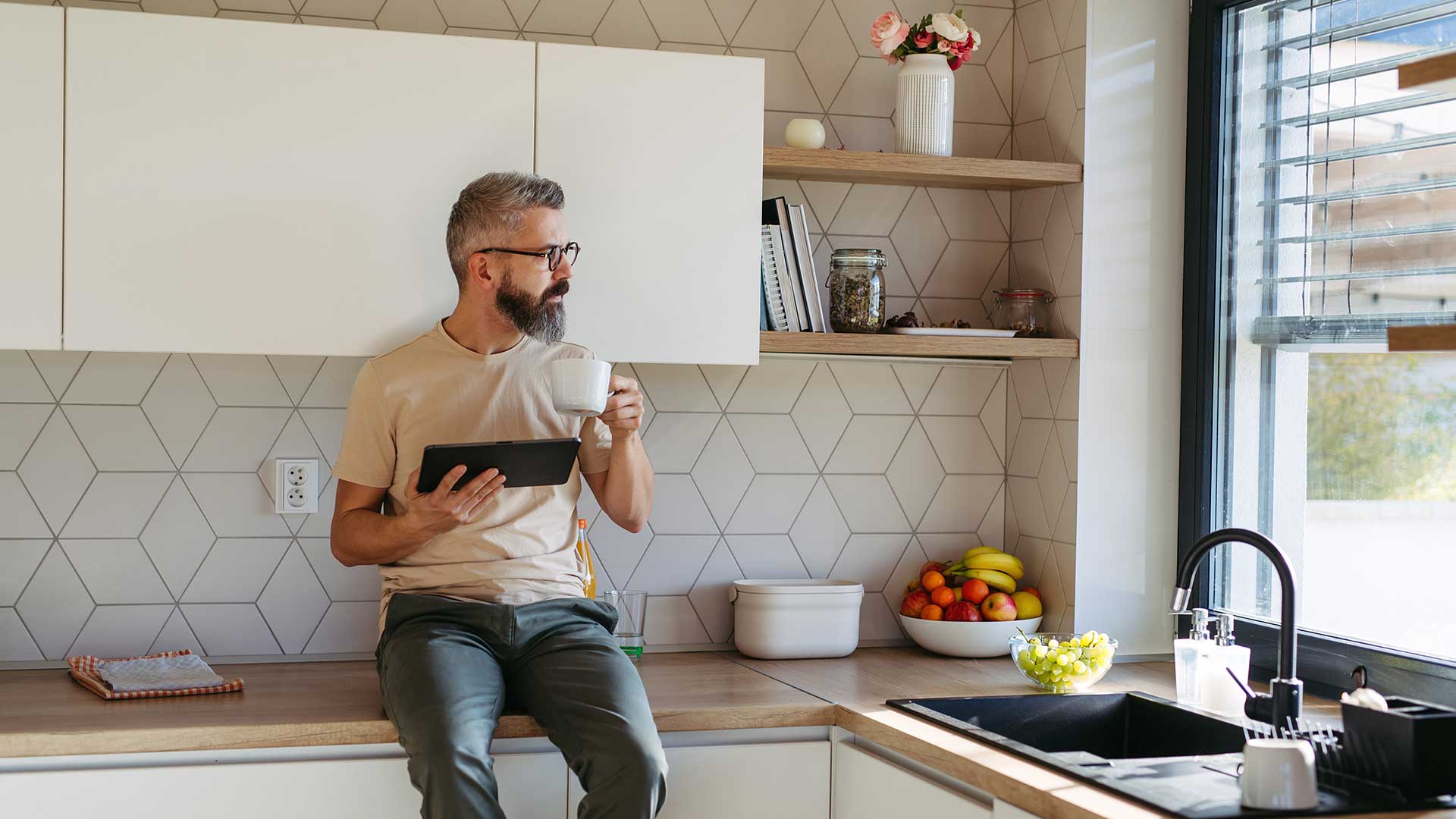 Picture that shows little girl touching a speaker at dinner table with family